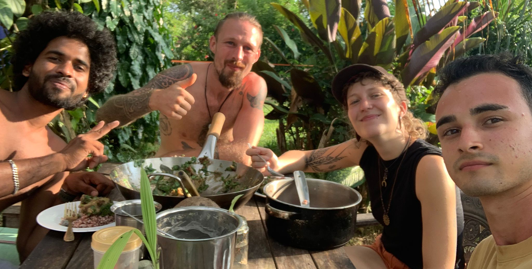 Four people sharing a meal outdoors